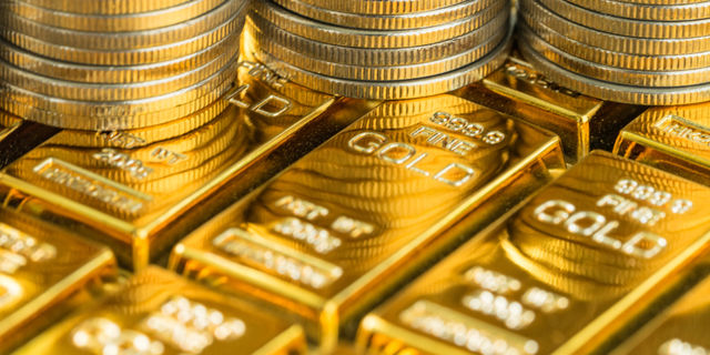 Gold goes down as improved economic surge output spurs risk appetite